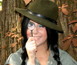 Girl Looking Through Magnifying Glass