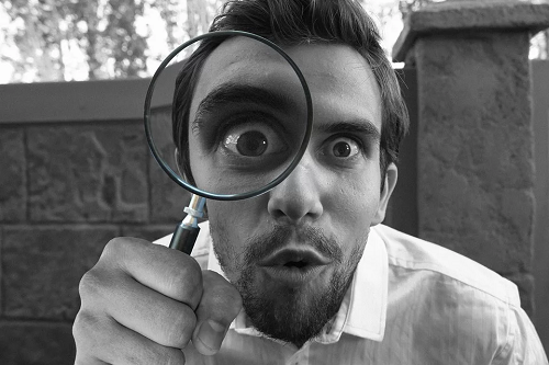 Magnifying glass in front of eye